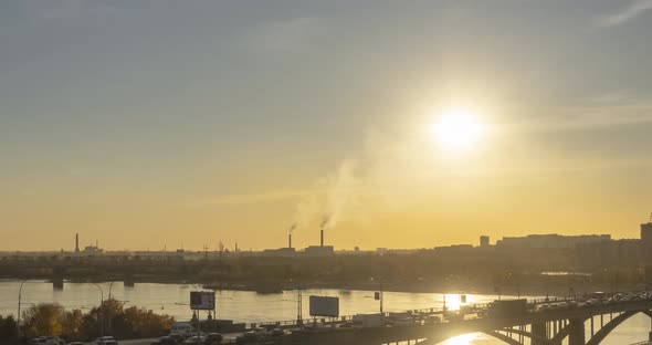 Timelapse of City Life. Sun Rays, Blue Sky, River and Bridge Over Horizont. Traffic Jam at Summer