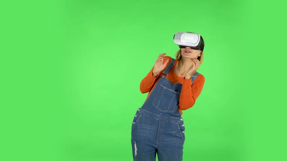 Woman with Virtual Reality Goggles. Green Screen