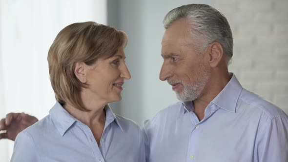 Aged Man and Woman Looking at Each Other, Putting Heads Together, Family Harmony