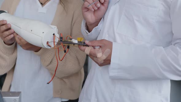 Close Up Girls and Techer's Hands with 3D Printed Hand