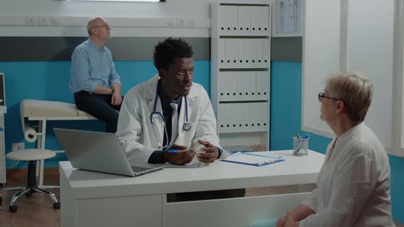 Man with Uniform Working As Doctor Doing Consultation