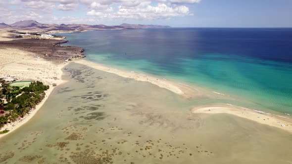 Stunning aerial drone shot of sunny Playa de Sotavento de Jandía, Fuerteventura, beach, spain