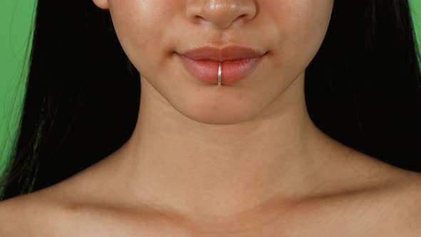 Female Lips with Lip Ring Piercing