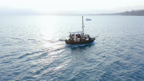 Beautiful Yacht with Tourists Floating on the Sea