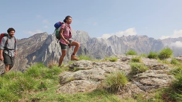 Group of Hikers Walking at Top of Mountain