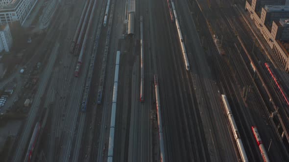 Multiple Train Tracks on with 2 Trains Moving on Beautiful Sunny Day with Little Traffic Due To