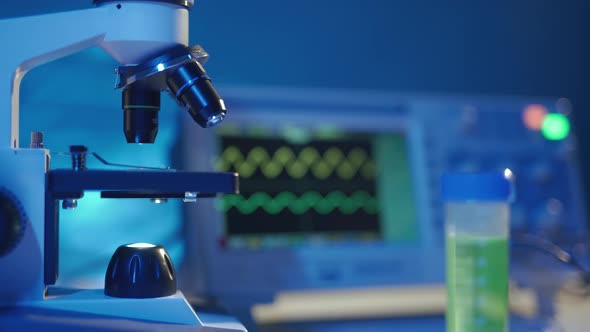 Close Up of a Optical Scientific Microscope in Laboratory alt