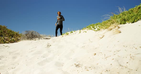 Triathlete man jogging on a trail