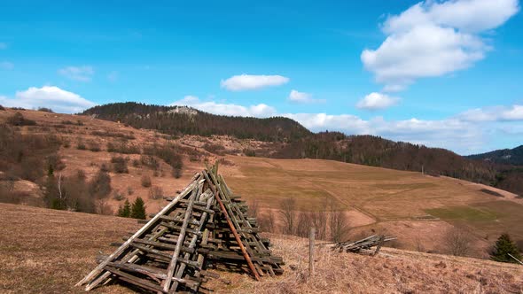 Rural landscape, dry grass on pastures. blue sky with clouds. Early spring landscape.