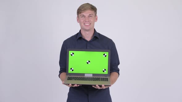 Happy Man Showing Laptop with Green Screen