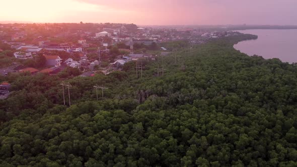 2.7K Bali Highway Miracle Sunset Ocean Aerial