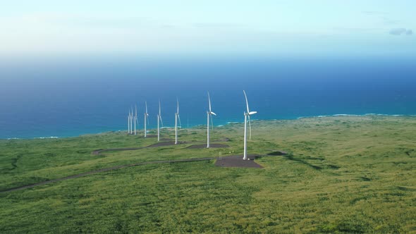 Aerial View of Powerful Wind Turbine Farm for Energy Production on Green Meadow