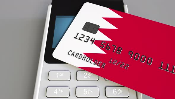 Paying with Credit Card with Flag of Bahrain