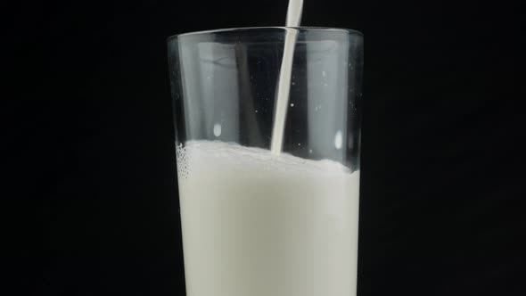 Pouring milk in the glass