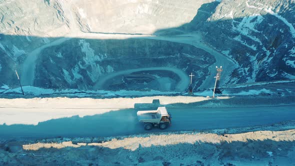 Top View of a Loaded Truck Riding on the Edge of an Open Pit