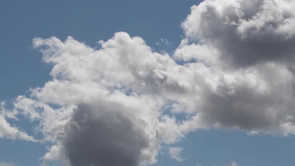 Clouds Avanzing in a Blue Sky