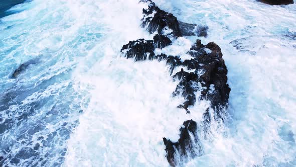 Ocean Waves Crash Against the Rocky Shore the Coastline of the Mediterranean Sea During a Storm