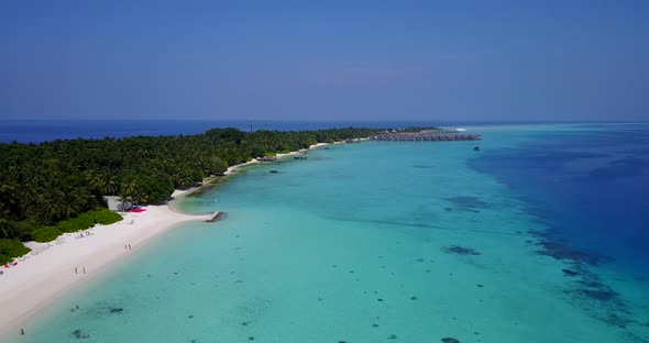 Natural aerial travel shot of a summer white paradise sand beach and blue water background in colorf