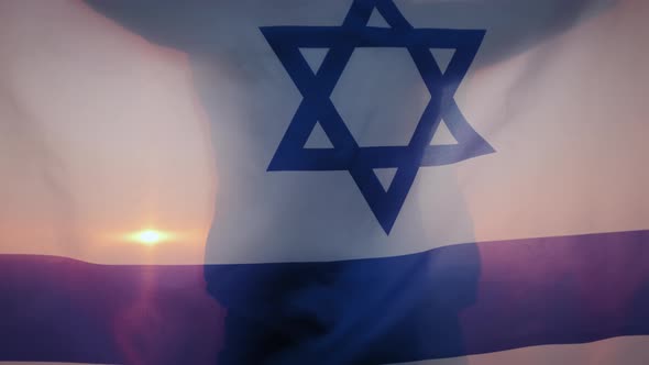 A Woman Stand with the Flag of Israel Against a Clear Sky at Sunset