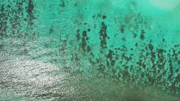 Aerial top view landscape of tranquil coastline beach vacation by turquoise ocean and white sand bac