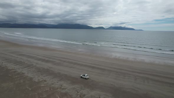 Drone tracking car on Inch beach Dingle peninsula Ireland