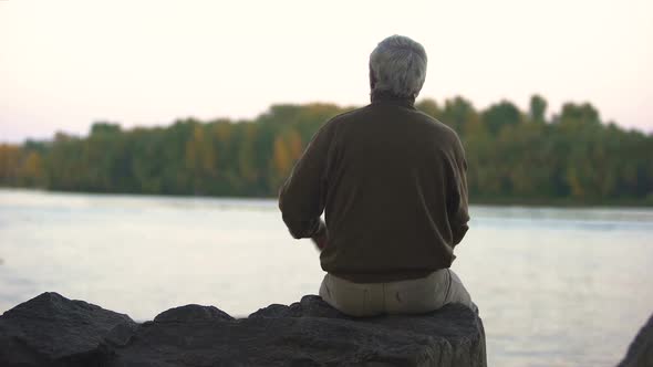 Sad Grandfather Sitting River Bank Back View, Old Age Loneliness, Peaceful Rest