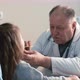 Pediatrician examining little child's throat - VideoHive Item for Sale