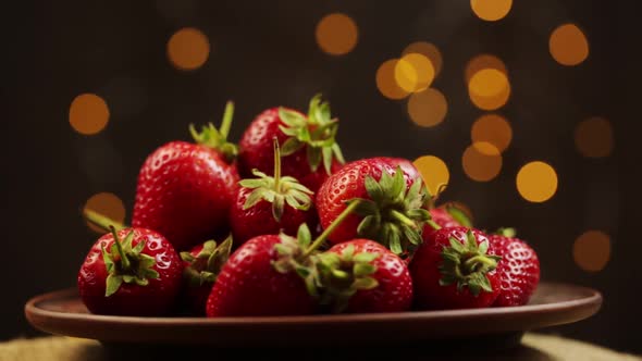 Plate With Ripe Strawberries Rotates