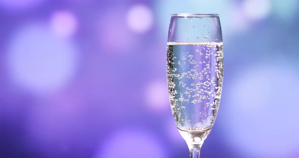 Sparkling Champagne over holiday background