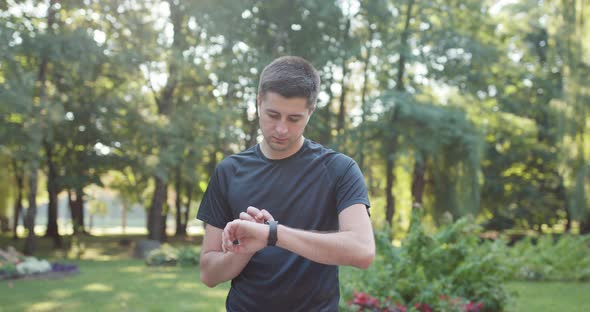 Man Runner Using Smart Watch After Workout