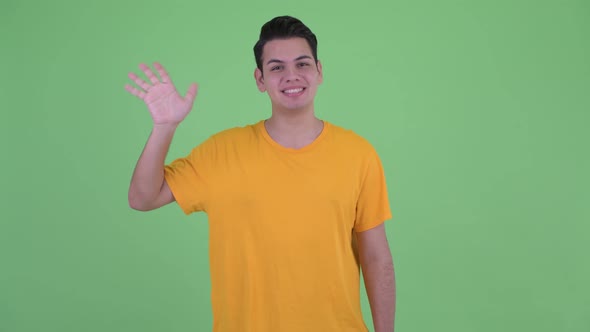 Happy Young Multi Ethnic Man Waving Hand