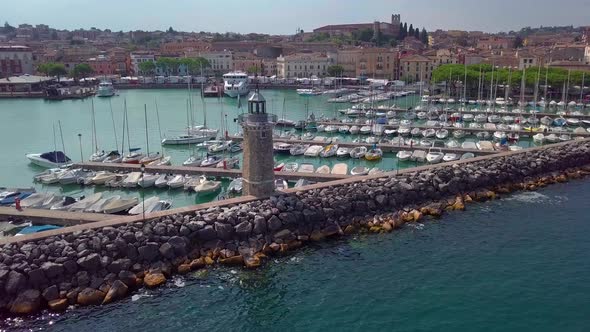 Aerial View of Boats and Lighthouse in Lake Garda, Italy