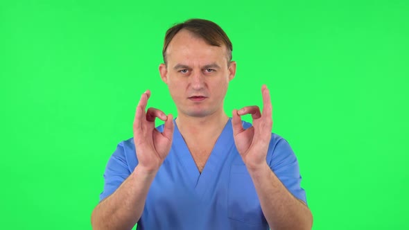 Medical Man Makes Sign Ok. Green Screen