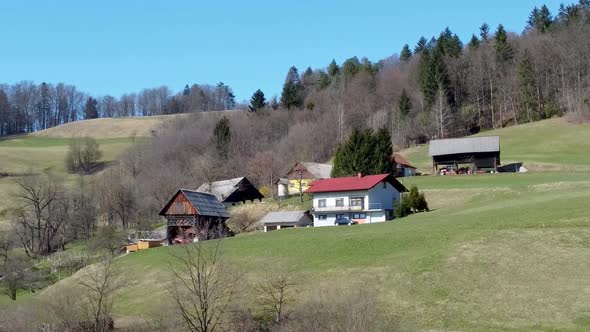 Aerial Approaching Traditional Slovenian House on a Hill, Bed and Breakfast Concept