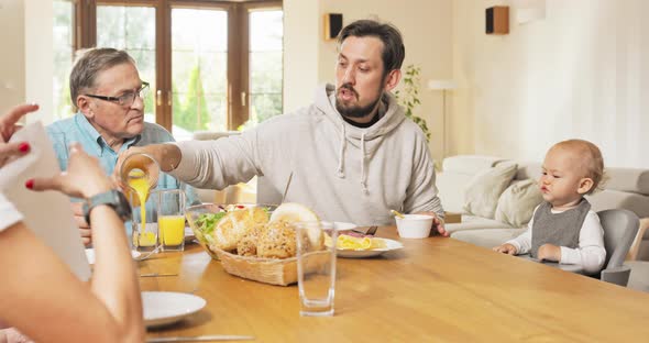 Family Breakfast at Home at the Dining Table Living Room