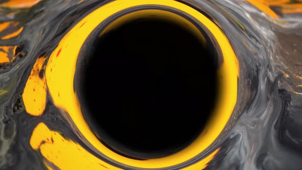 Black hole. Yellow, white, black and metallic gold color paint mix. Decorative abstract background