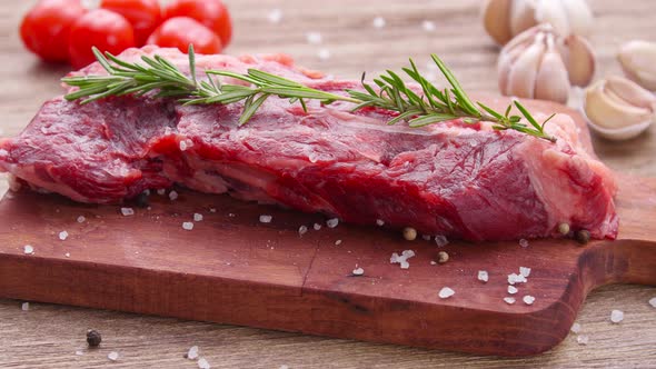 Raw Beef Steak on a Wooden Table