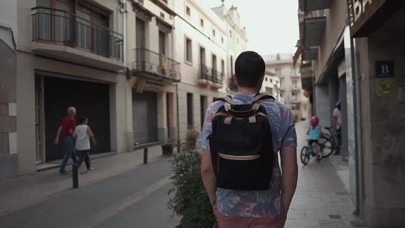 Young Tourist Walking Around in City