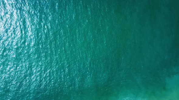 Sea view from above. Video for the background. Real view of the ocean from a drone. Calm waves and w