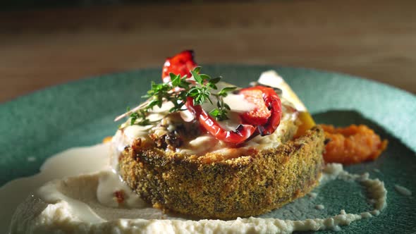 Fish with Puree and Roasted Vegetables in Restaurant.