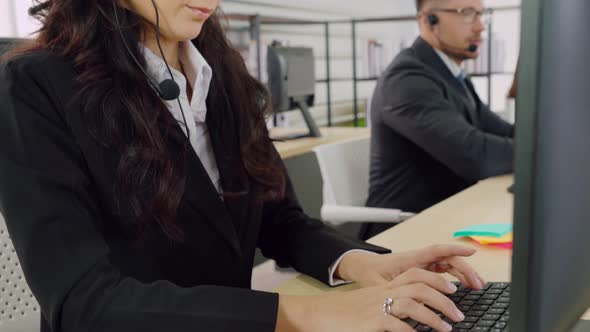 Business People Wearing Headset Working in Office