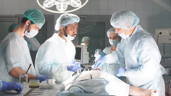 Concentrated Surgical Team Operating a Patient in an Operation Theater