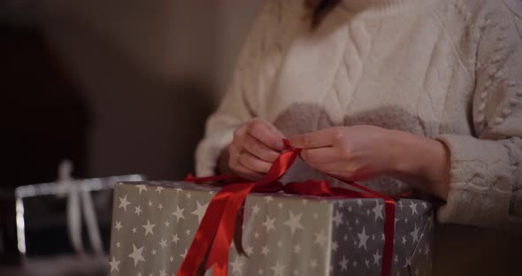 Happy Woman Unboxing Christmas Gift