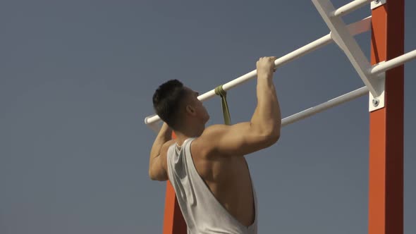 Man Doing Pullups Exercises