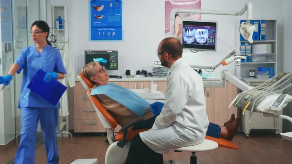 Orthodontist Discusses an MRI Scan with Patient