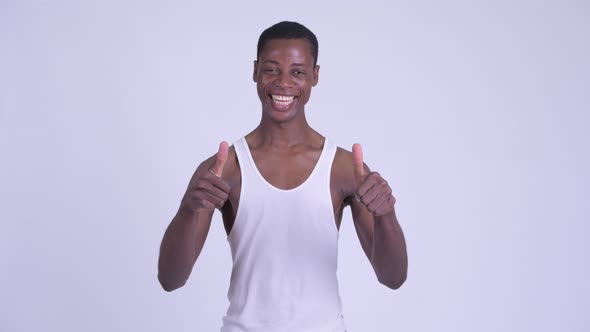 Young Happy African Man Giving Thumbs Up and Looking Excited