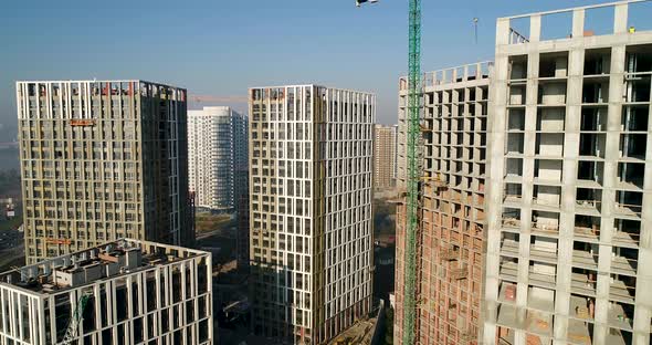 Landscape in the City with Under Construction Buildings and Industrial Cranes