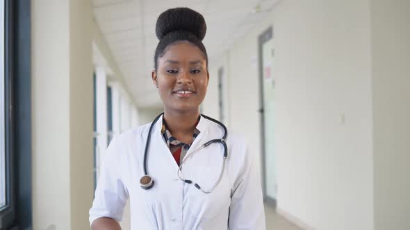 Smiling Young African Female Doctor Close Up Portrait