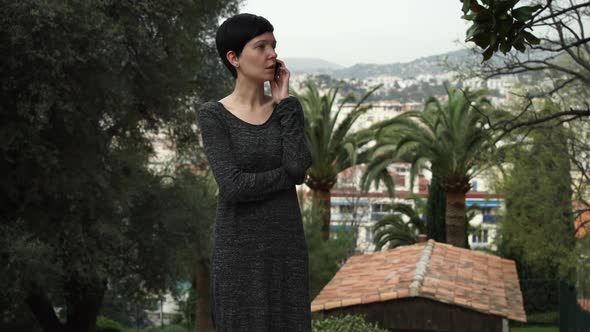 Portrait Attractive Woman Calling on the Mobile Phone in the Mediterranean City