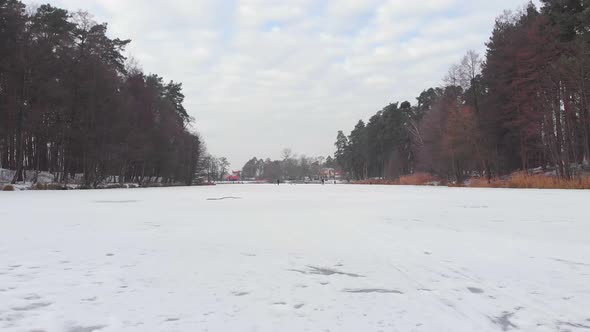 People Walk Frozen River alt